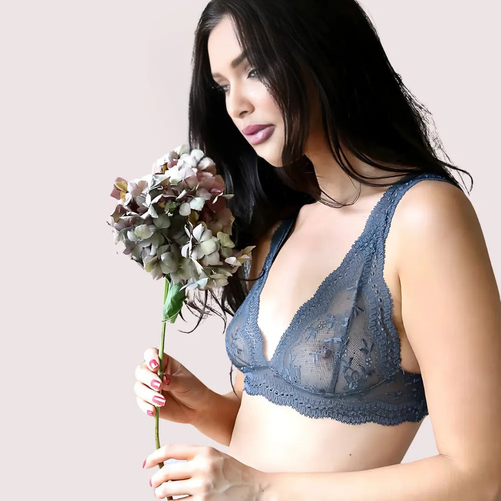 Ultra-Luxe French-Inspired Bralette Set by French Daina – model holding a flower while showcasing the charcoal lace bralette with intricate floral lace details. KozyKlicks luxury lingerie.
