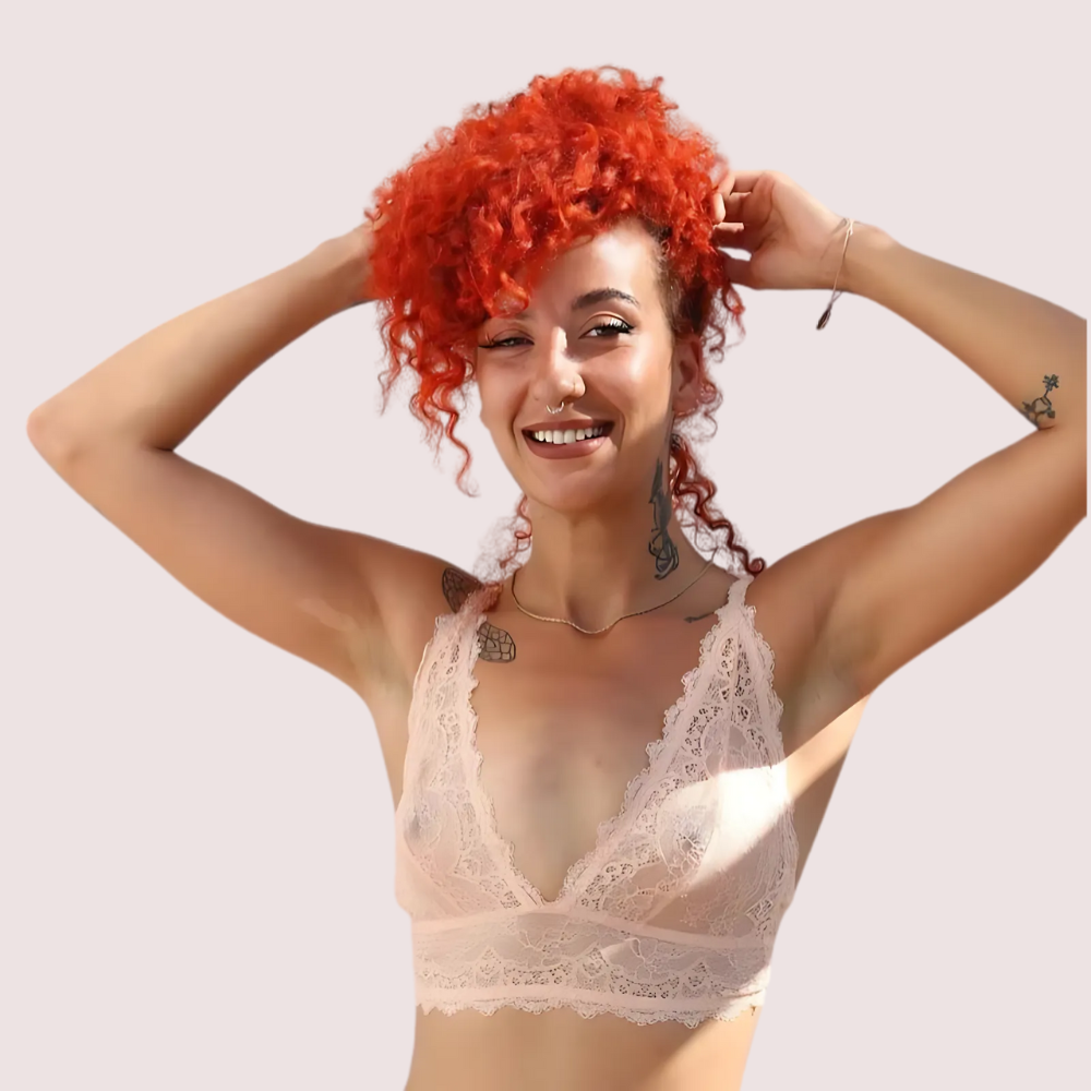 French-Inspired Premium Bralette Gift Box – French Daina Signature blush lace bralette, front view showing deep V-neck lace design on a model with curly red hair. KozyKlicks stylish lingerie collection.
