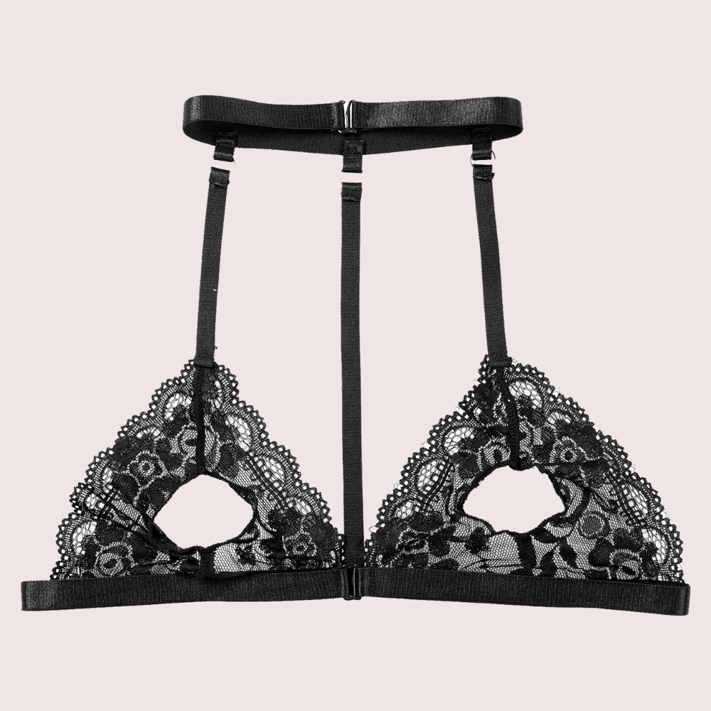 Flat lay of KozyKlicks Midnight Temptation sheer lace bralette, showcasing adjustable straps and open-cup lace design.

