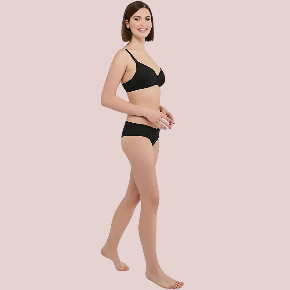 Cozy Curve Cotton Set – women’s black cotton bra and panty set, side walking view featuring soft wireless bra and comfortable mid-rise panty. Breathable everyday lingerie by KozyKlicks.
